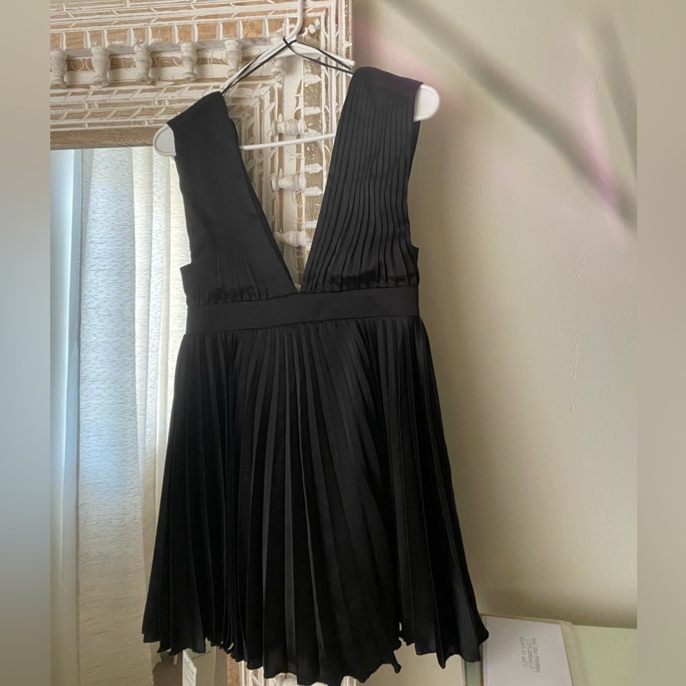 Black plunge neck pleated mini dress